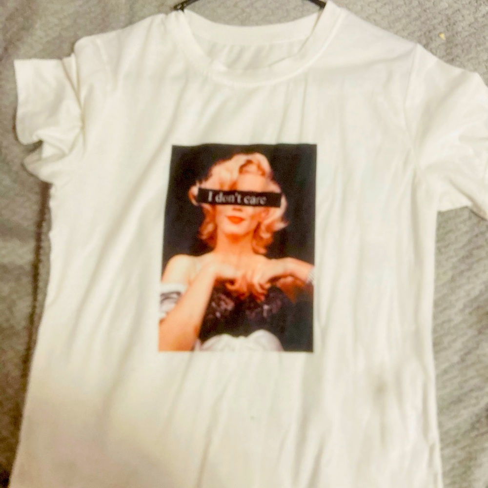 White trendy tee-shirt (“I don’t care”)